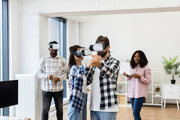 istock Group of Colleagues Using Virtual Reality Headsets in Modern Office 2238136455