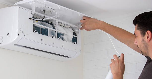 istock Deep AC Cleaning. Treating the Evaporator with Cleaning Foam 2238137577