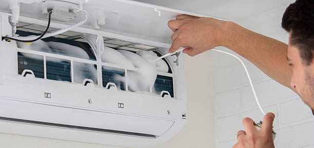 istock Deep AC Cleaning. Treating the Evaporator with Cleaning Foam 2238137580