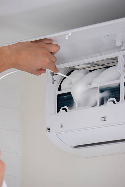 istock Deep AC Cleaning. Treating the Evaporator with Cleaning Foam 2238137584