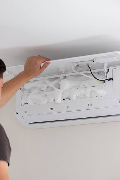 istock Deep AC Cleaning. Treating the Evaporator with Cleaning Foam 2238137591