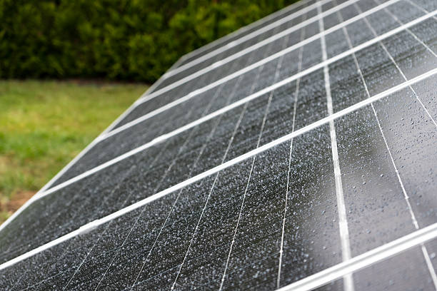 istock Macro of Solar Panels with Rain Droplets 2238138366