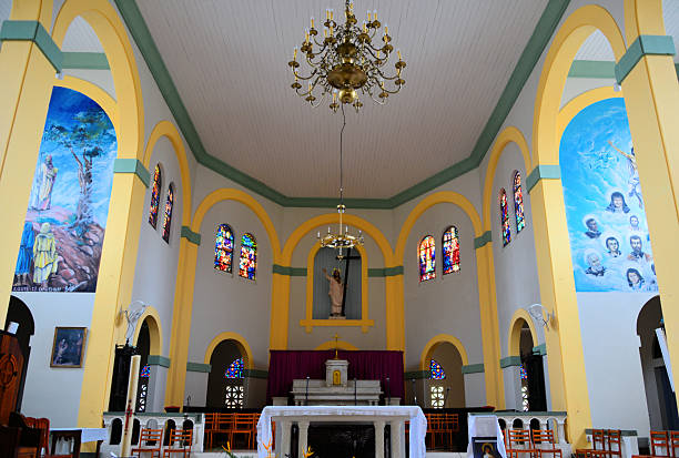 Cayenne, French Guiana: the Cayenne Cathedral on Lallouette Street, officially known as the Cathédrale Saint-Sauveur de Cayenne, serves as the Roman Catholic cathedral and seat of the Diocese of Cayenne. Constructed between 1823 and 1833, it was originally built as the église Saint-Nicolas before being elevated to cathedral status in 1934 and renamed Saint-Sauveur. Designated a national monument of France, it remains an active place of worship with regular masses and is noted for its historical significance.