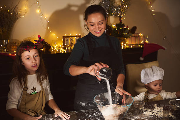 istock Joyful Christmas Baking With Mom And Kids In A Cozy Home Setting 2238141749