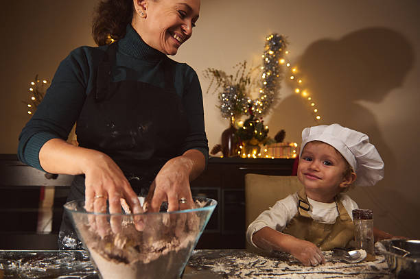 istock Joyful Mom Baking With Child For Christmas In Cozy Home Kitchen 2238141757