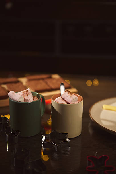 Cozy Baking Scene With Mugs, Marshmallows, And Cookie Cutters Ready For Holiday Treats