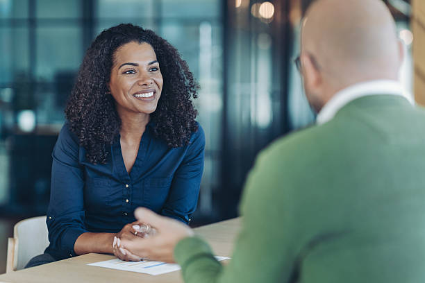 istock Bank manager talking to a customer 2238143121