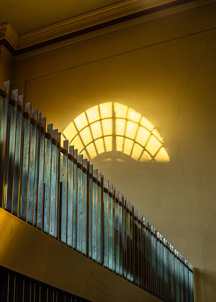 Sunlit Window Shadow on the Wall and a wooden fence