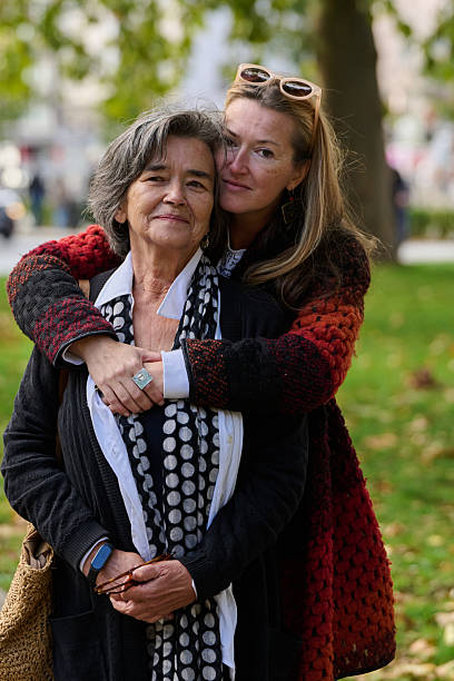 istock A Heartfelt Embrace: A Daughters Support for Her Mother on a Beautiful Autumn Day. 2238146301