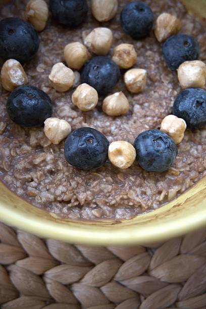 istock Chocolate Oatmeal with Hazelnuts and Blueberries Close-Up Healthy Breakfast 2238146478