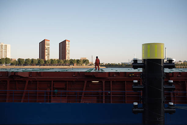 Tugboat - port and cityscape of Antwerp at dusk