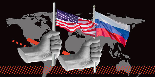 istock Hands holding American and Russian flags over world map, symbolizing global unity or tension. Ideal for political art, media, and design. Minimalist art collage 2238148582