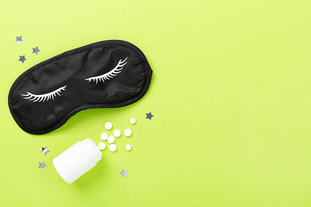istock Sleeping mask with pills on color background, top view 2238151078