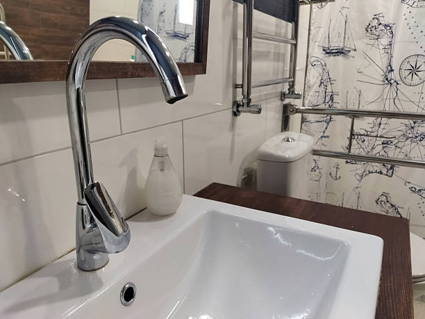 istock Modern bathroom with a sleek faucet and nautical decor 2238155178