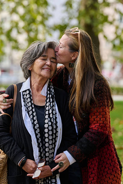istock A Heartfelt Embrace: A Daughters Support for Her Mother on a Beautiful Autumn Day. 2238157946