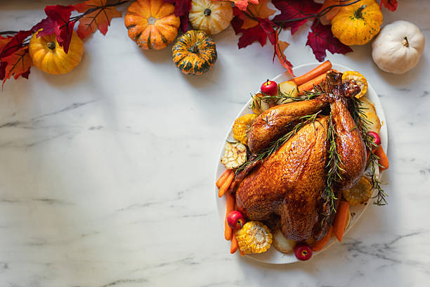istock Preparing turkey with side dishes for Thanksgiving celebration 2238164882