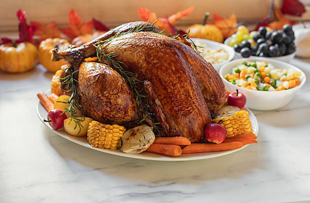 Preparing traditional turkey with side dishes for Thanksgiving Day