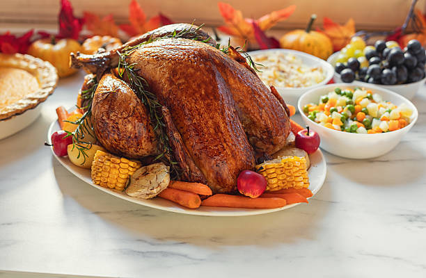 Preparing traditional turkey with side dishes for Thanksgiving Day