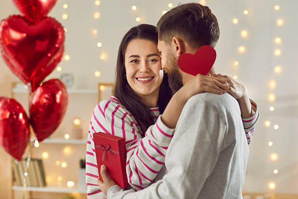 istock Happy smiling young couple hugging each other at home 2238166666