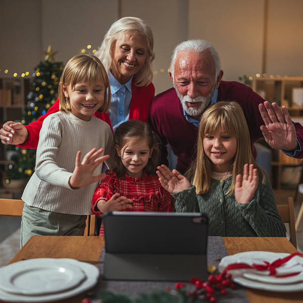 istock Family doing video call during christmas holiday celebration 2238174235