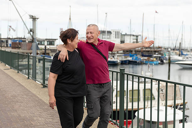 istock Beautiful senior couple on a day trip on a waterfront marina 2238176599