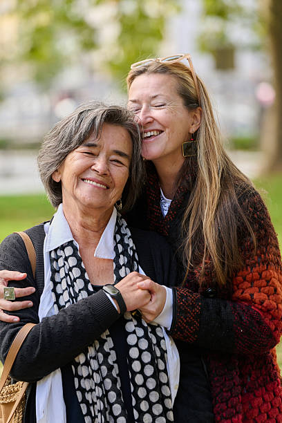 istock A Heartfelt Embrace: A Daughters Support for Her Mother on a Beautiful Autumn Day. 2238178099