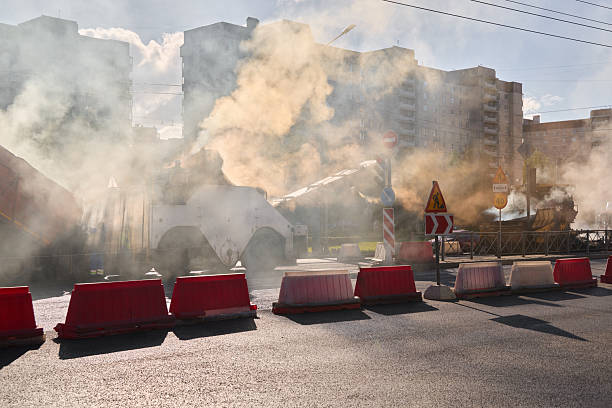 istock During the daytime, there is construction creating smoke and barriers affecting traffic in the city 2238180107