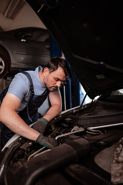 istock Mechanic working on a car engine in an auto repair shop during daylight hours 2238182853