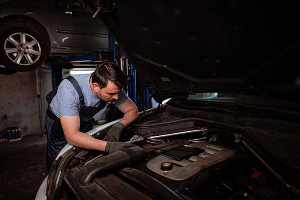 istock Mechanic repairs car engine in workshop during day 2238182981