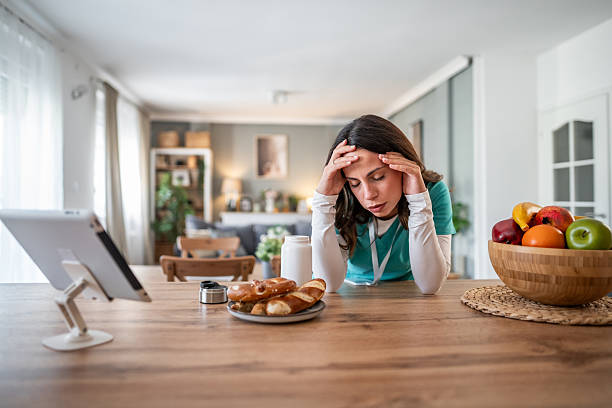 istock Healthcare worker experiencing burnout and headache at home 2238183379