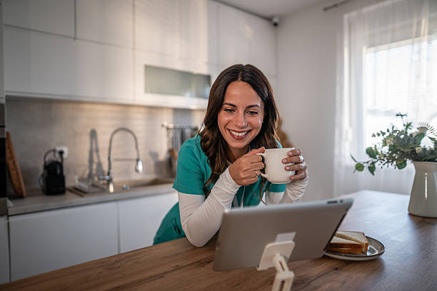 istock Female healthcare worker having video call breakfast 2238183406