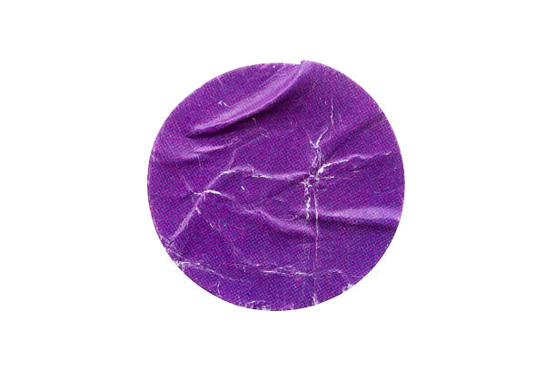 istock Blank purple round adhesive paper sticker label isolated on white background 2238187725