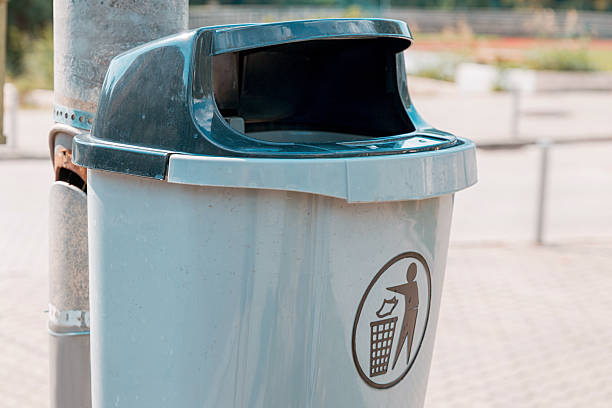 istock Empty modern trash can with disposal instruction sign, encouraging cleanliness and responsible waste management in a public space 2238188554