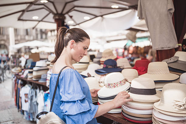 istock Browsing Stylish Hats at Outdoor Market 2238190267