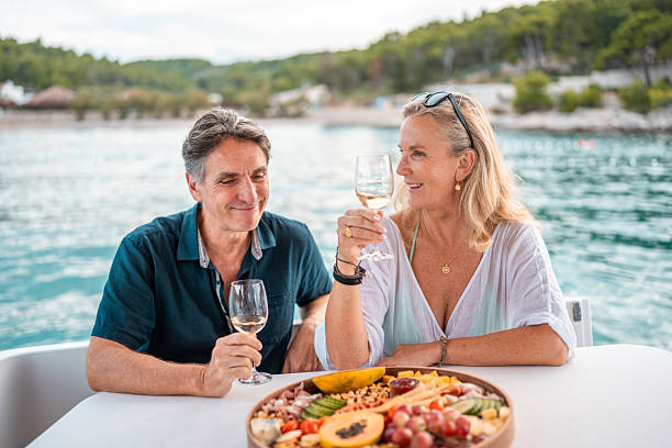 istock Mature Couple Enjoying Wine on Adriatic Boat 2238190676