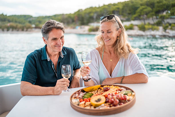 istock Mature Couple Enjoying Wine on Adriatic Coast 2238190679