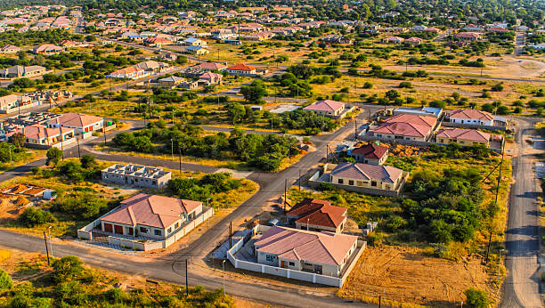 istock aerial view Gaborone daytime ,residential area and lush vegetation, plot and streets 2238199216