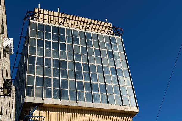 istock Modern Architectural Design of a Tall Highrise Building Set Against a Bright Blue Sky 2238203490