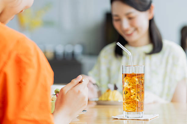 istock Friendly young women having tea in a cafe 2238204530