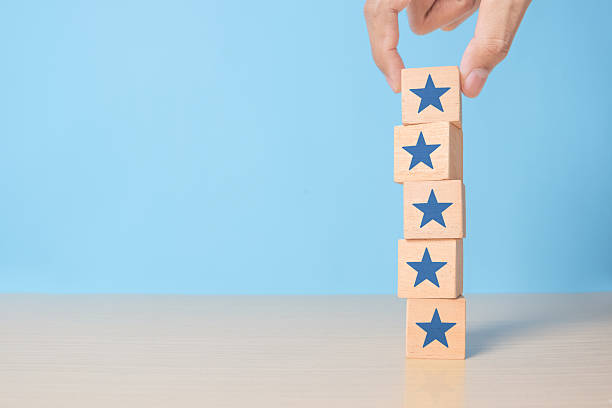 istock Hand put wooden blocks stacking with the five star symbol on the table, evaluation, Increase rating, Customer experience, satisfaction and best excellent services rating concept 2238208167