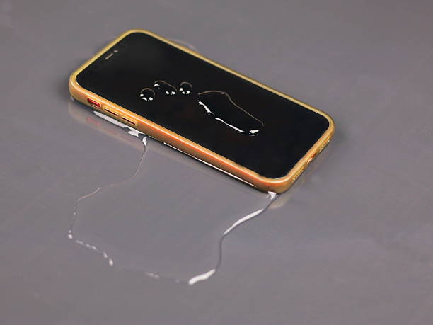 istock This image shows a smartphone placed on the floor, with water drops on the screen and water spills around the device. 2238209339