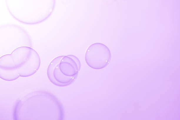 istock Beautiful Clear Purple Soap Bubbles Floating in The Air. Celebration Festive Backdrop. Freshness Soap Suds Bubbles Water. Purple and White Gradient Textured. 2238219910