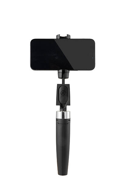 istock Selfie stick with smartphone with white background 2238220439