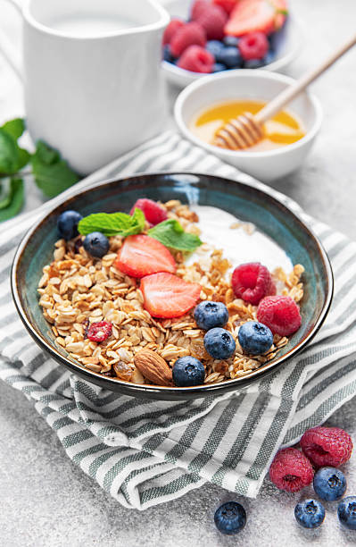 istock Granola bowl with yogurt, berries, and mint for breakfast 2238222863
