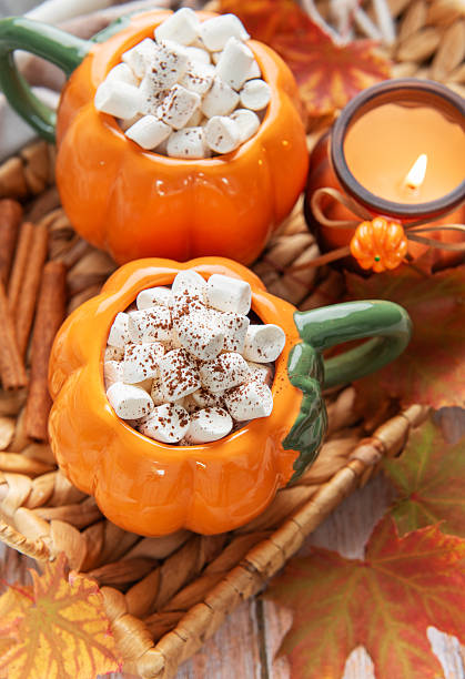 istock Pumpkin mugs with hot chocolate for autumn cozy warmth 2238222872