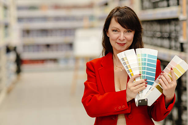 istock Interior designer choosing paint color from swatches in hardware store 2238223113