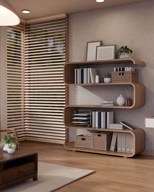 Unique design bookshelf or display shelf under lamp light and wooden table on carpet in living room.