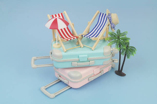 istock Blue and red beach chairs with hat, umbrella, pink suitcase and blue and palm tree on blue background. 2238225143