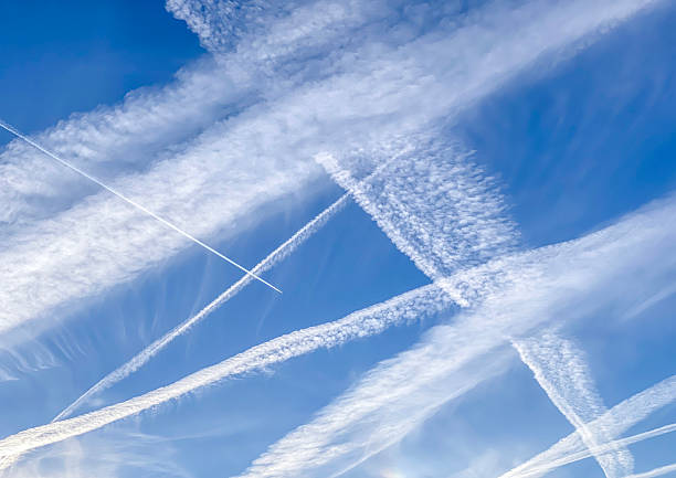 Condensate stripes on a blue sky.