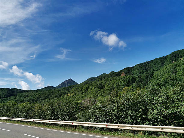 istock Scenic green mountains with clear sky above highway 2238229680
